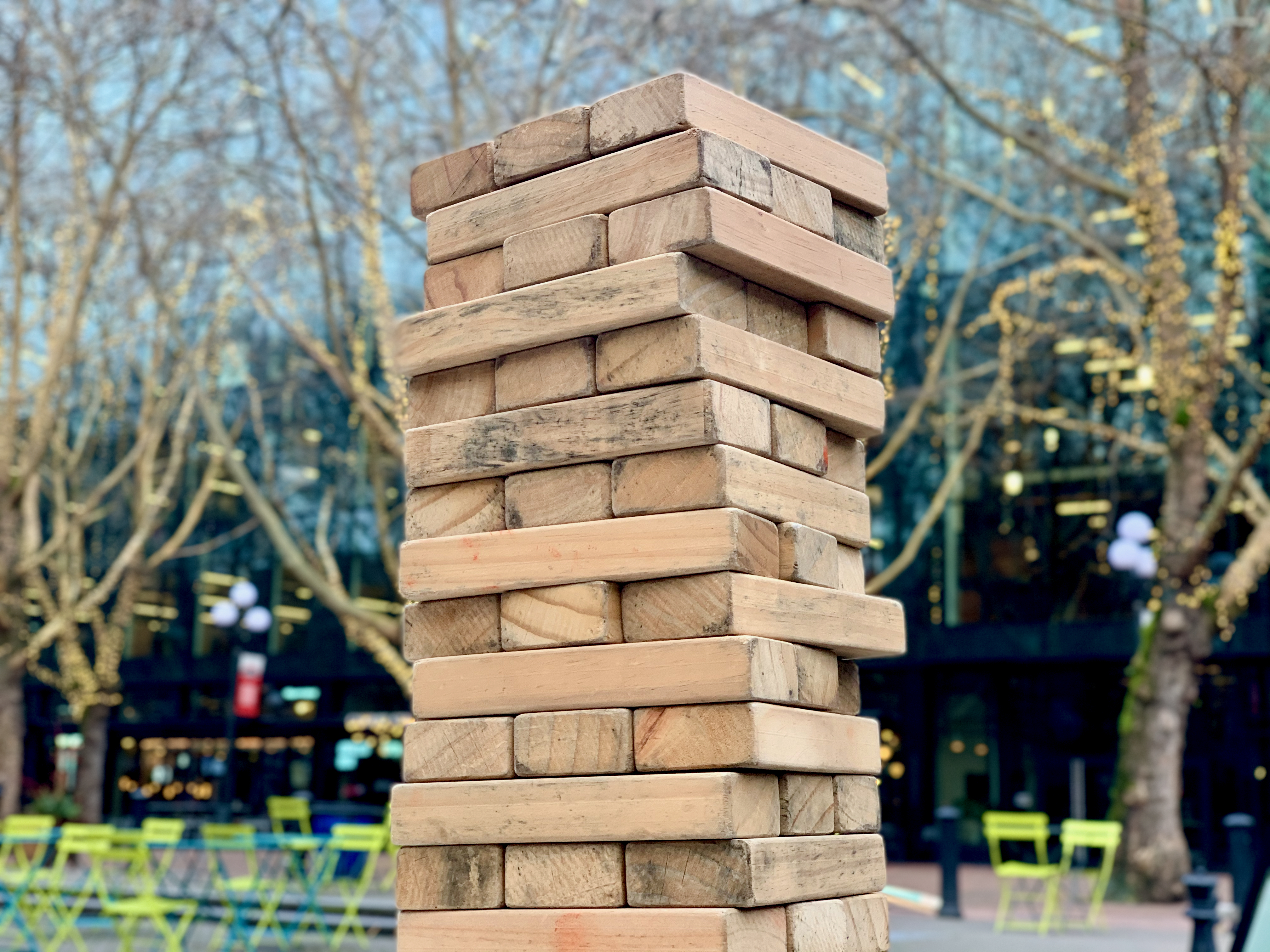 Day 15. <i>Balance</i>. A giant game of Jenga awaits at <a href="https://www.seattle.gov/parks/find/parks/occidental-square">Occidental Square</a>.